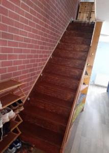 a staircase leading up to a brick wall at Bastolino in Newtongrange