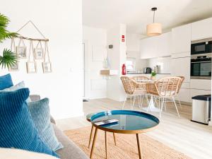 a living room with a couch and a table at Carvoeiro Beach House in Carvoeiro