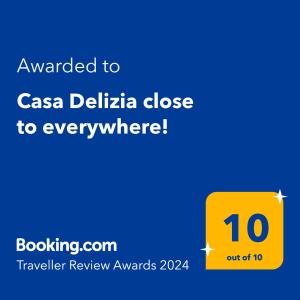 a yellow sign with the text awarded to casa delica close to everywhere at Casa Delizia close to everywhere! in San Juan