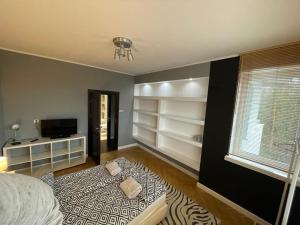 Ένα ή περισσότερα κρεβάτια σε δωμάτιο στο Apartament 6 piętro