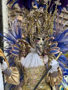 a person dressed in a blue and gold costume at Sweet Passion in Venice