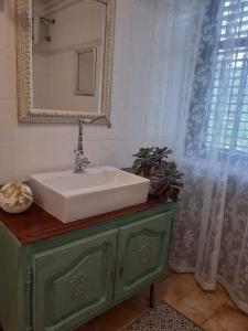 a bathroom with a sink and a mirror at Apartment Bella Rosa in Koper
