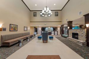 a lobby with a couch and a fireplace at Best Western Plus French Lick in French Lick