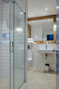 a bathroom with a toilet and a sink at Rose and Crown Stoke Newington in London