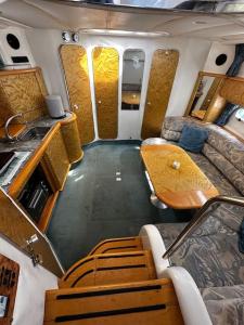 an interior view of an rv with a table and chairs at Le Grand Bleu - idéal Festival de Cannes in Cannes