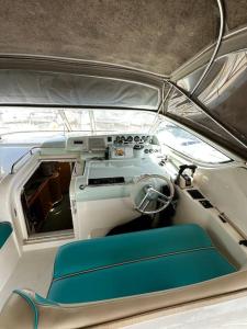 a view of the cockpit of a boat with a blue seat at Le Grand Bleu - idéal Festival de Cannes in Cannes