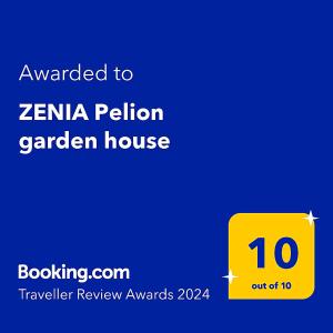 a yellow sign that reads awarded to zenia peloton garden house at ZENIA Pelion garden house in Platanidia