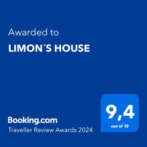 a blue sign that reads awarded to limons house at LIMON´S HOUSE in Puerto Limón