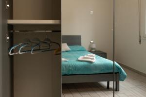 A bed or beds in a room at M.G Home a un passo da tutto