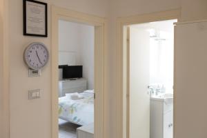 A bed or beds in a room at M.G Home a un passo da tutto
