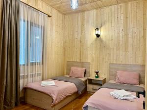 a room with two beds and a window at Milenium magic villa on Sevan beach in Sevan