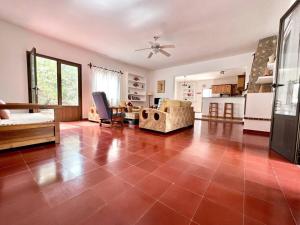 a large living room with a large tile floor at Villa Skiba Es Caló Formentera in Es Calo