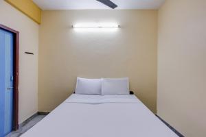 Postelja oz. postelje v sobi nastanitve SPOT ON Bt Mansion Near Marina Beach