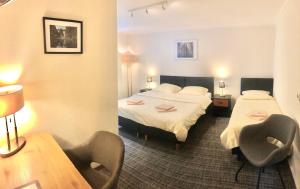 Letto o letti in una camera di Hotel Auberge Rustique