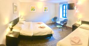 Letto o letti in una camera di Hotel Auberge Rustique