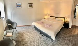 Letto o letti in una camera di Hotel Auberge Rustique