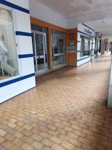 an empty lobby of a building with glass doors at Residencial S. Gião in Valença