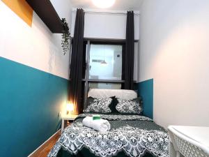 a bedroom with a bed with a teddy bear on it at Relaxing Closed Partition Room in Tecom Near Metro in Dubai