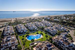 an aerial view of a resort near the beach at Bajo con porche en primera línea En Vera, Almeria in Vera