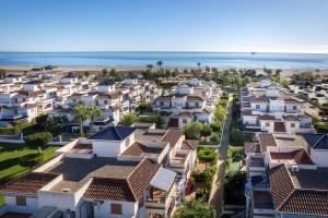 an aerial view of houses in front of the beach at Bajo con porche en primera línea En Vera, Almeria in Vera