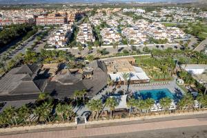 an aerial view of a resort with a swimming pool at Bajo con porche en primera línea En Vera, Almeria in Vera