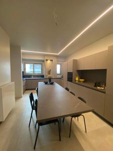 a kitchen and dining room with a table and chairs at Sapfo Luxury Apartment in Athens in Athens