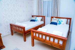 Katil atau katil-katil dalam bilik di Flo's Eco Residence +59 gambar