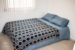 Ένα ή περισσότερα κρεβάτια σε δωμάτιο στο pousada pé na areia