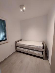 Postel nebo postele na pokoji v ubytování Pitagora Residence