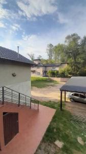 a car parked in a parking lot next to a house at Tantanakuy 2 in Villa General Belgrano +1 photo