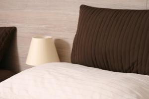 Postel nebo postele na pokoji v ubytování Hotel Klara