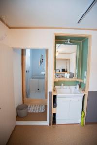 a bathroom with a sink and a mirror at Otaro Village - Vacation STAY 63281v in Otaru