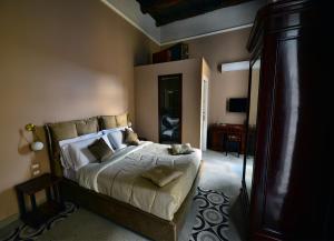 a bedroom with a large bed in a room at Xenia Neapolis in Naples