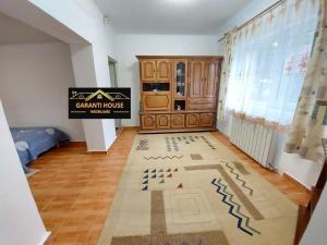 a room with a kitchen with a rug on the floor at House Bumba in Baia Mare
