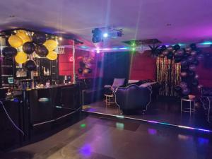 a party room with balloons and a dance floor at Private Luxury Club in Poznań