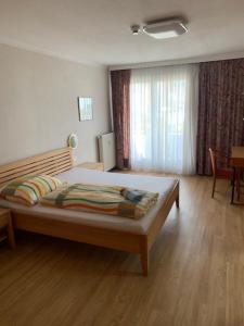 Postel nebo postele na pokoji v ubytování Cara Apartments