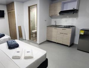 Kuchyň nebo kuchyňský kout v ubytování hotel medellin calasanz