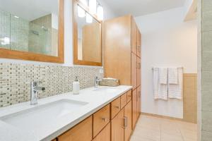 a bathroom with two sinks and a shower at Bright Chicago Home with Backyard Less Than 5 Mi to Downtown in Chicago