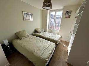 Кровать или кровати в номере Appartement lumineux en centre-ville / Proche Gare