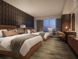 En eller flere senge i et værelse på Terre Haute Casino Resort + 14 billeder