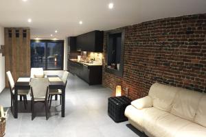 Χώρος καθιστικού στο Duplex style industriel à deux pas de la Place