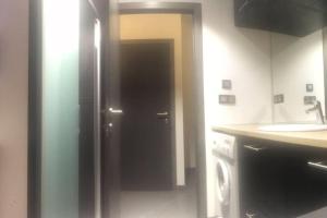 Η κουζίνα ή μικρή κουζίνα στο Duplex style industriel à deux pas de la Place