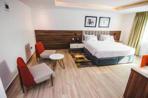 Posteľ alebo postele v izbe v ubytovaní The Safron Hotel