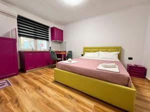 Postel nebo postele na pokoji v ubytování Keli’s apartments