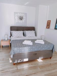 a bedroom with a bed with two towels on it at Marko apartment in Rovinj