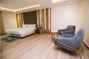 Posteľ alebo postele v izbe v ubytovaní The Safron Hotel