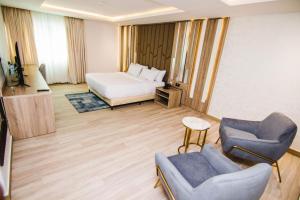 Posteľ alebo postele v izbe v ubytovaní The Safron Hotel