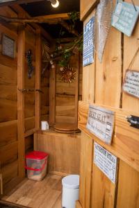 a wooden cabin with a keep safe sign on the wall at The Follies Glamping in Maidstone