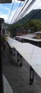 a long line of benches on a train station at Aracari Inn Mindo in Mindo