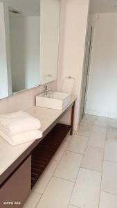 a bathroom with a sink and a mirror at Departamento nuevo en High Towers Elite, Sonata in Lomas de Angelopolis